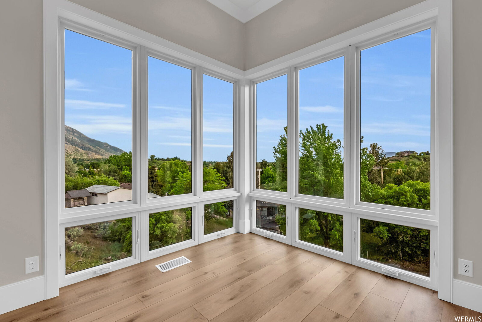 Corner bedroom with wraparound windows