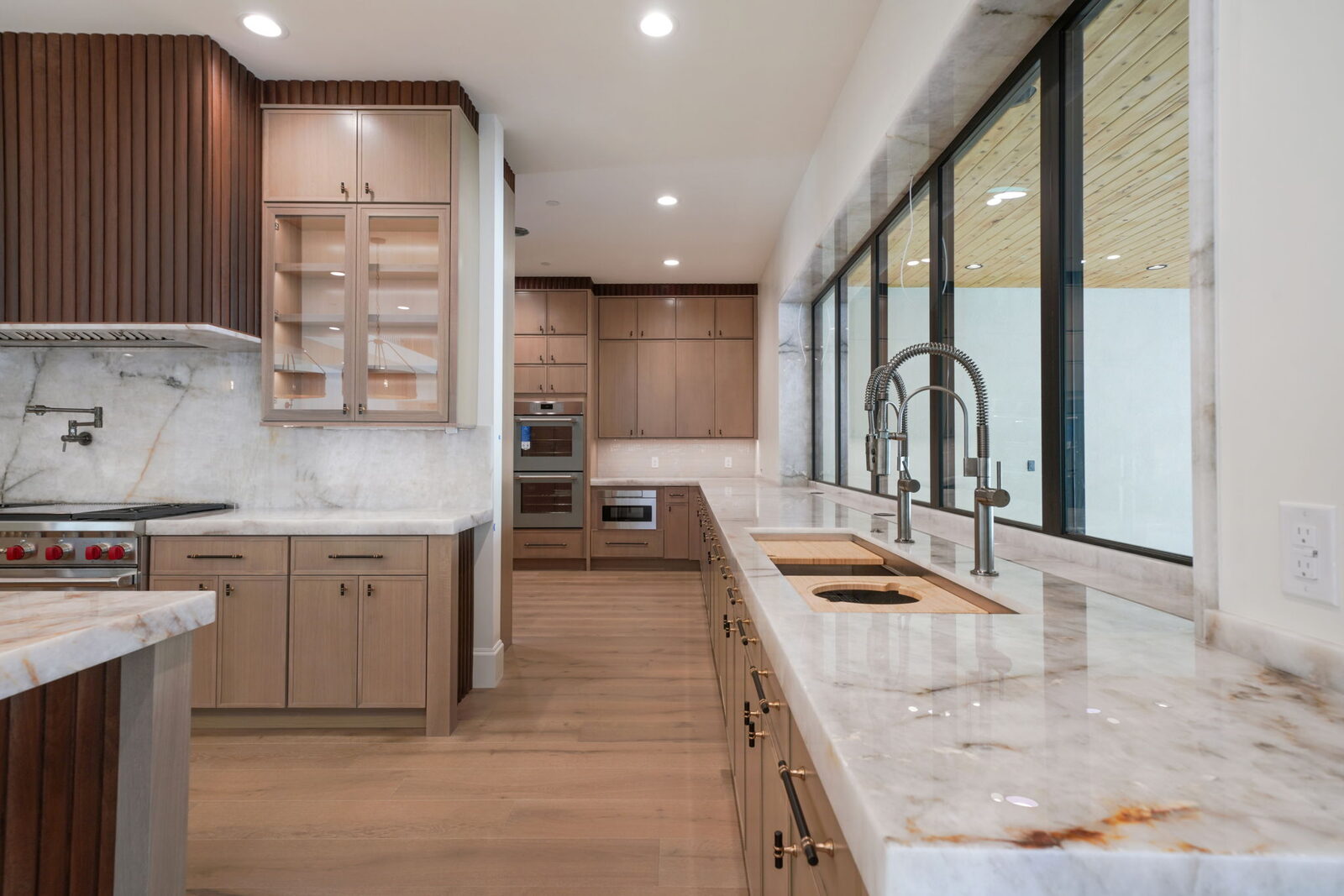 Kitchen with marble range wall and view window