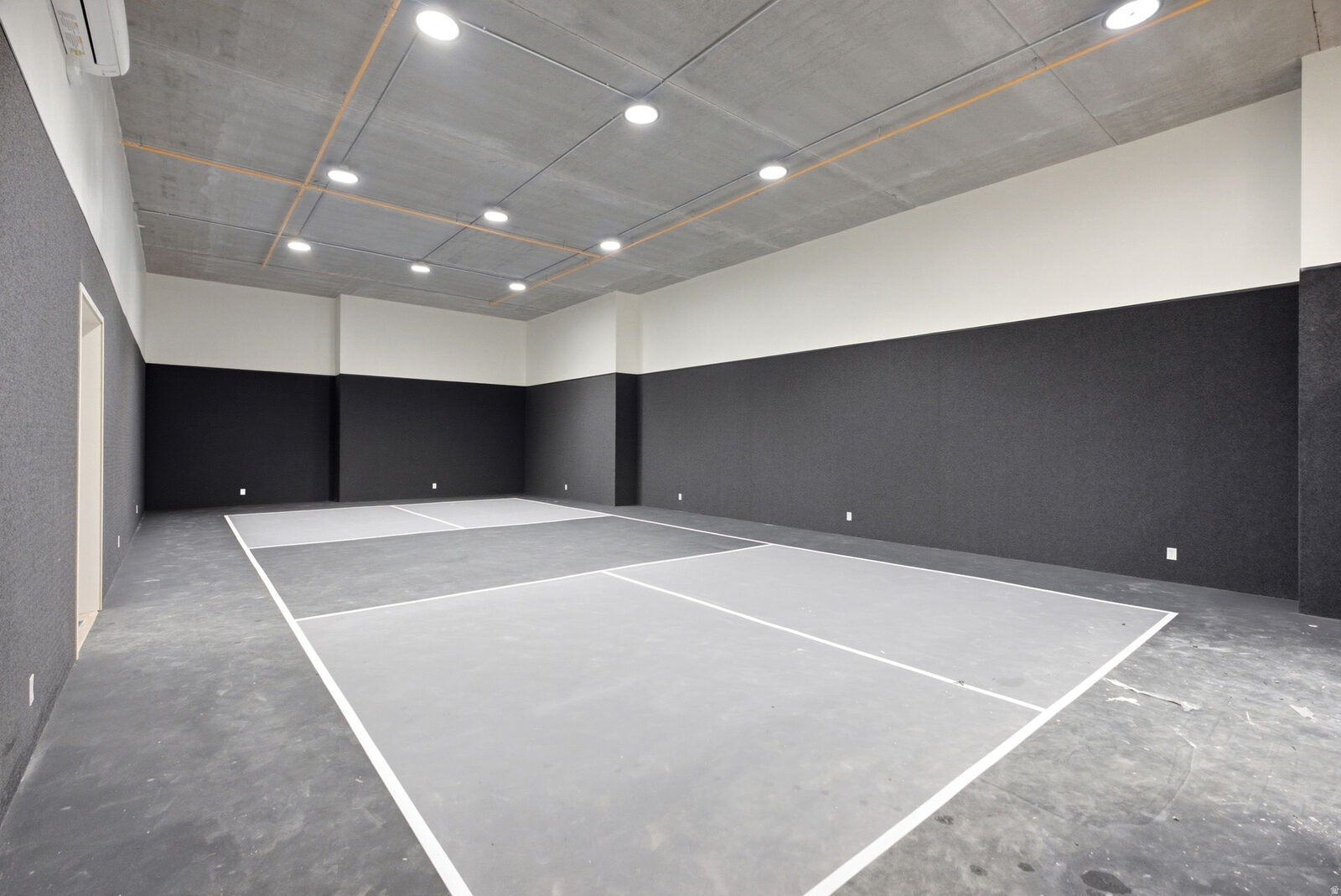 Indoor sport court with pickleball lines