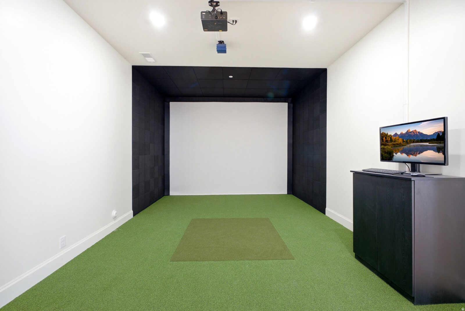Golf simulator room on the lower level